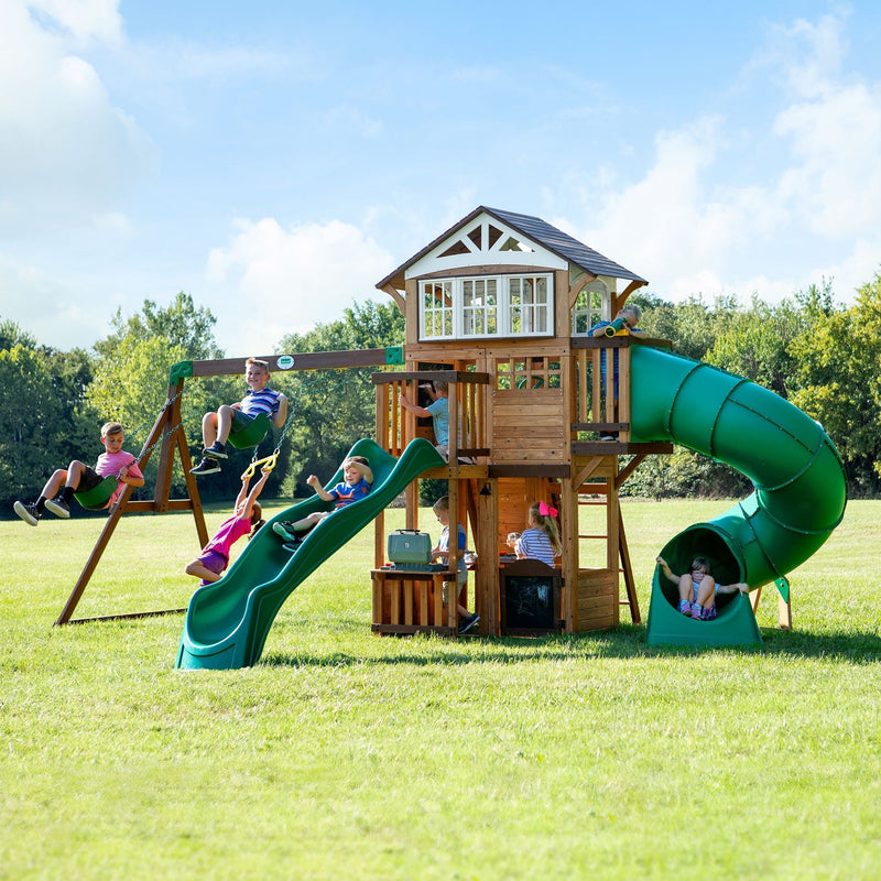 Discovery Kids' Bristol Point Cedar Wood Swing Set with Swing Beam, Upper & Lower Fort, Rock Wall & Slide Play for up to 11 Kids J0Z8
